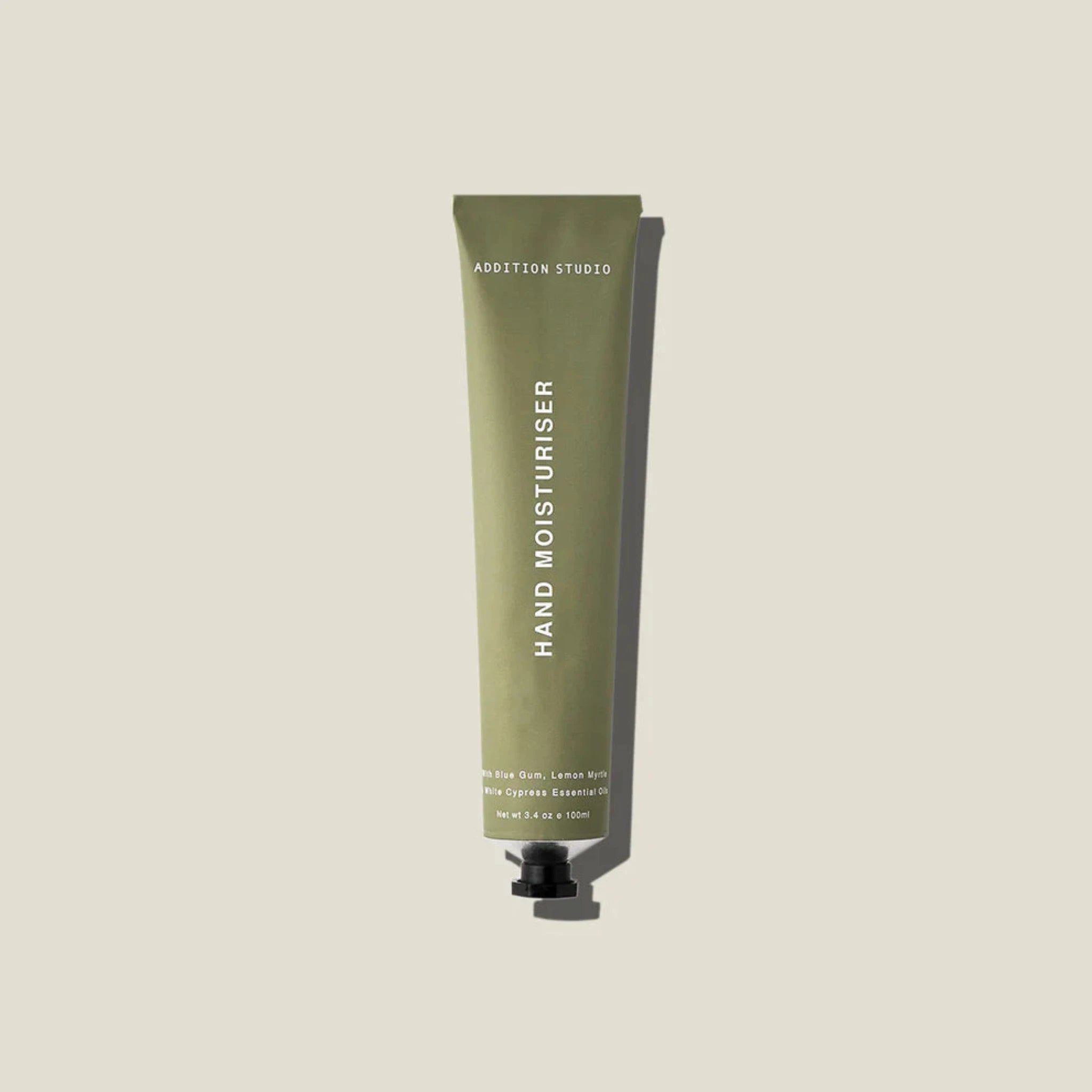 Hand moisturiser in a sage green coloured tube with white background.