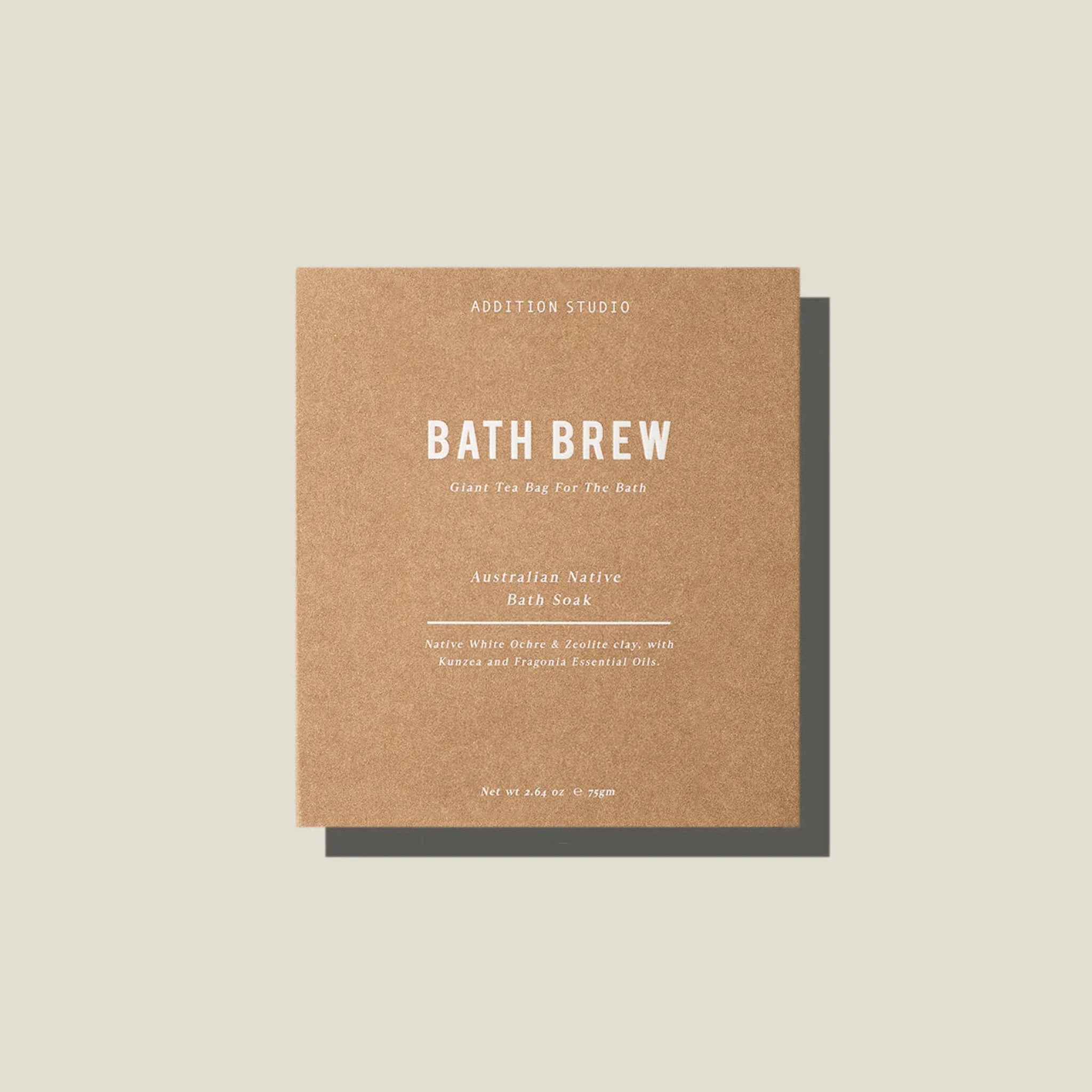 A brown card bath brew package containing a giant tea bag with Australian Native bath soak blend by Addition Studio.