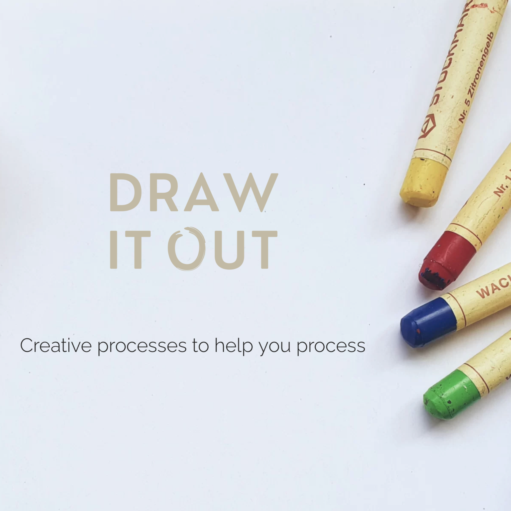 Colorful crayons on a white surface with &