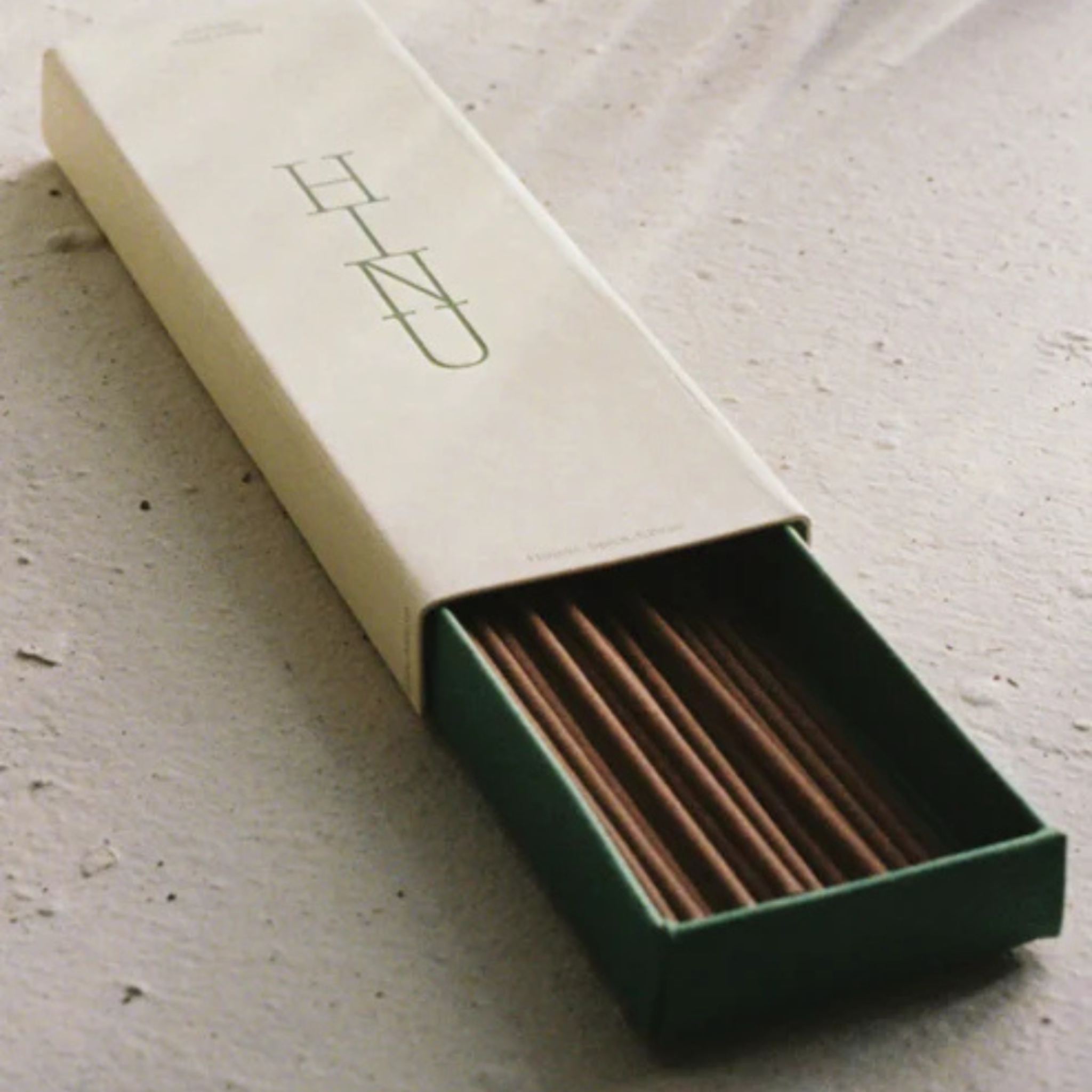 Open box of incense sticks with &