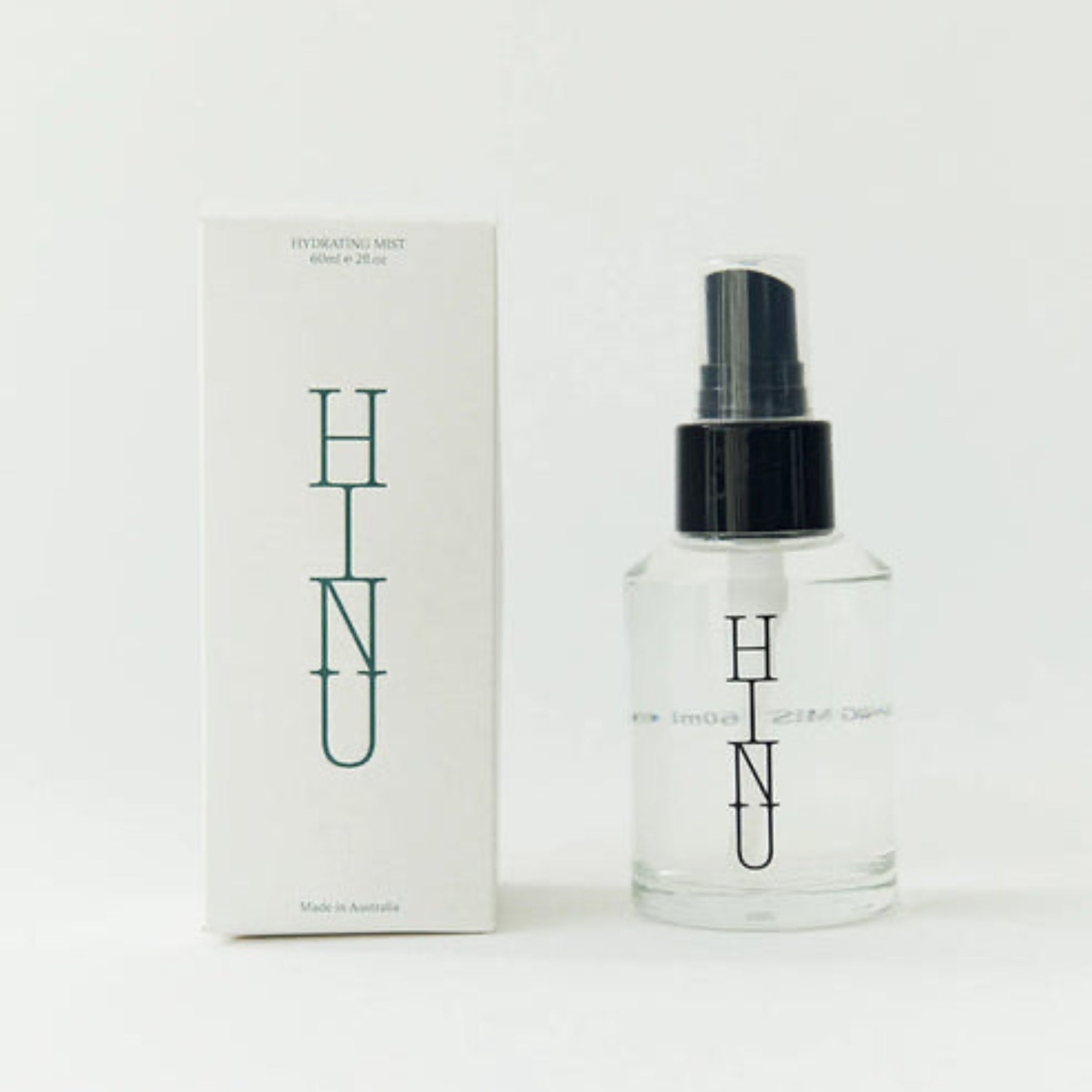 Clear spray bottle with black cap and &