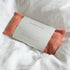 Biophilia herbal eye pillow with rose colour linen on a white fabric background