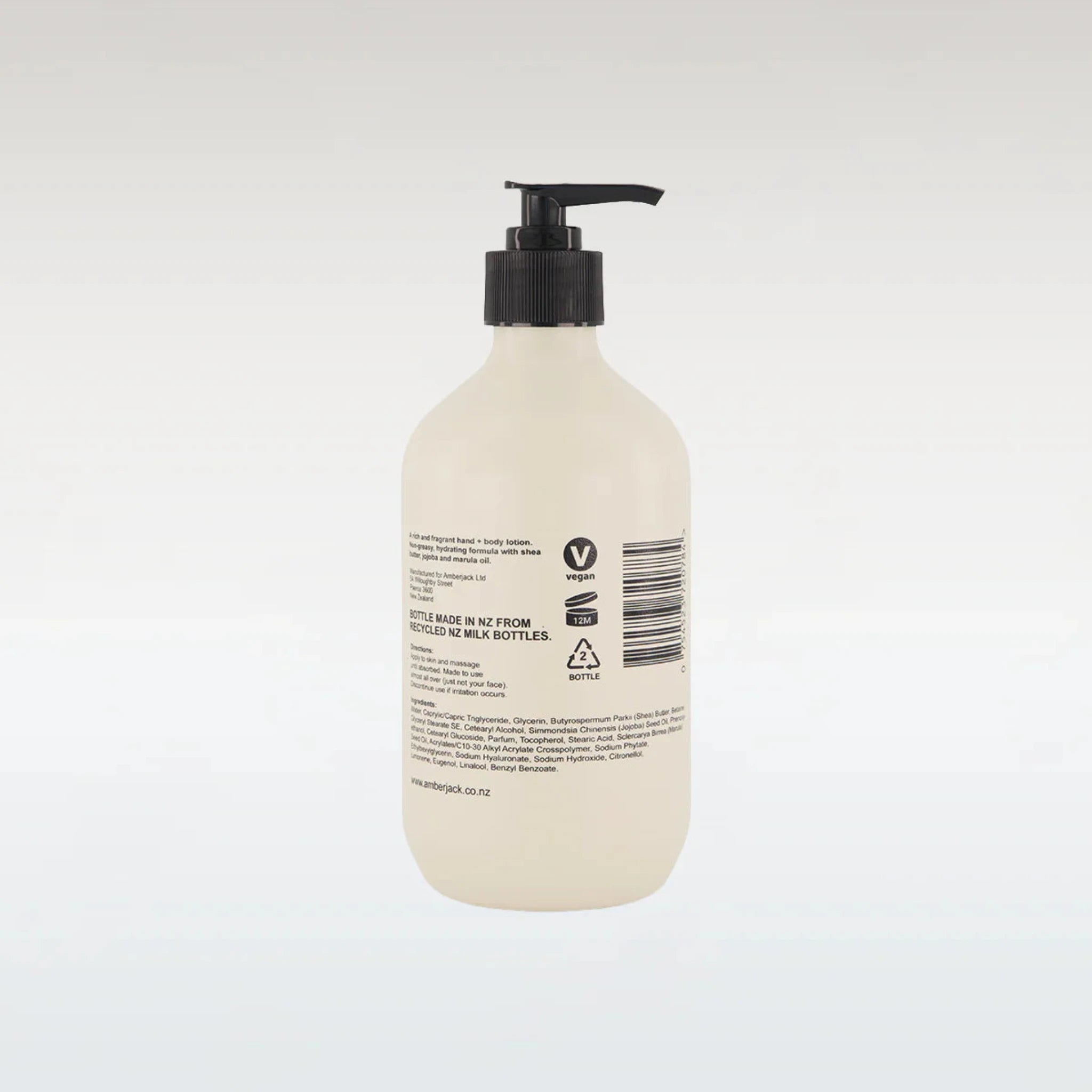 Beige bottle with black pump on a white background