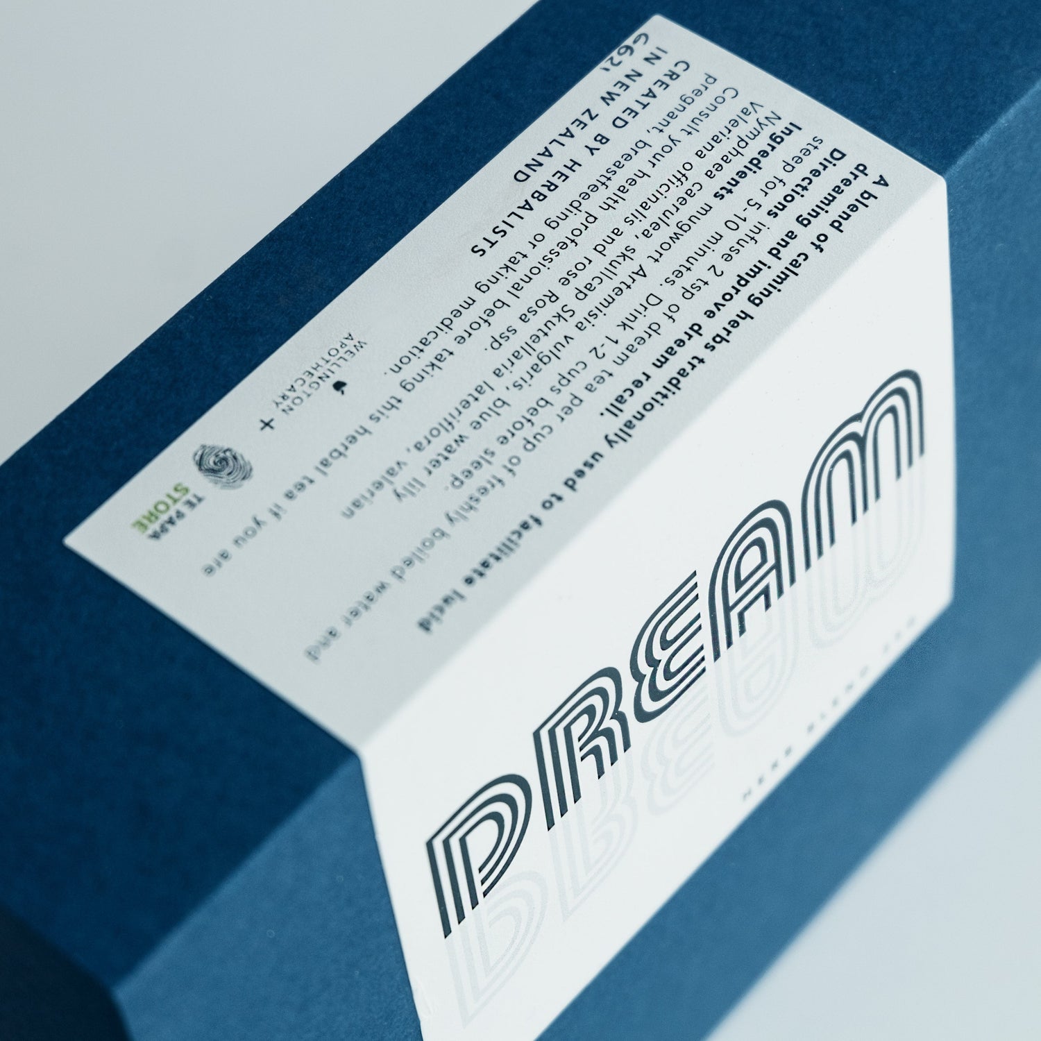 A navy blue box of the Dream Tea blend.