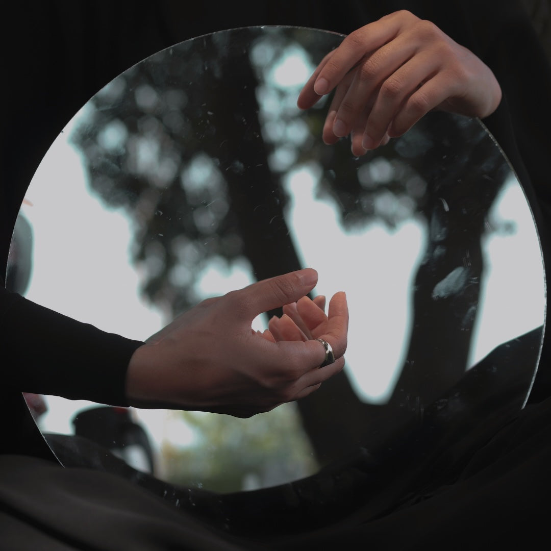 THROUGH A GLASS, DARKLY