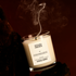 Candle labeled &