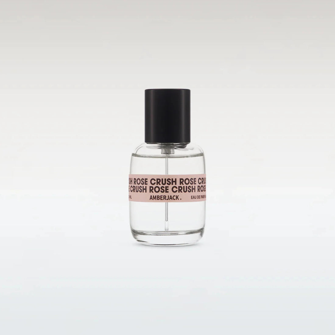 Perfume bottle with black cap and clear body on a white background