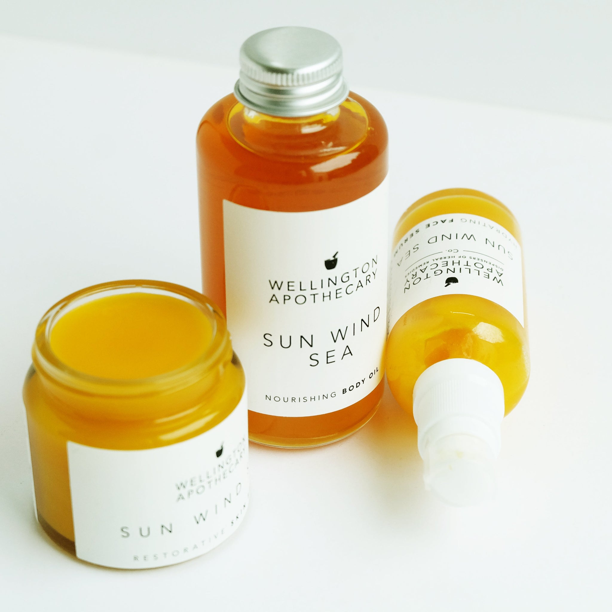 Wellington Apothecary Sun Wind Sea skincare products on a white background