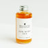 Bottle of Wellington Apothecary Sun Wind Sea body oil on a white background