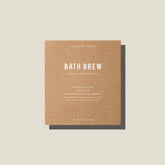 A brown card bath brew package containing a giant tea bag with Australian Native bath soak blend by Addition Studio. 