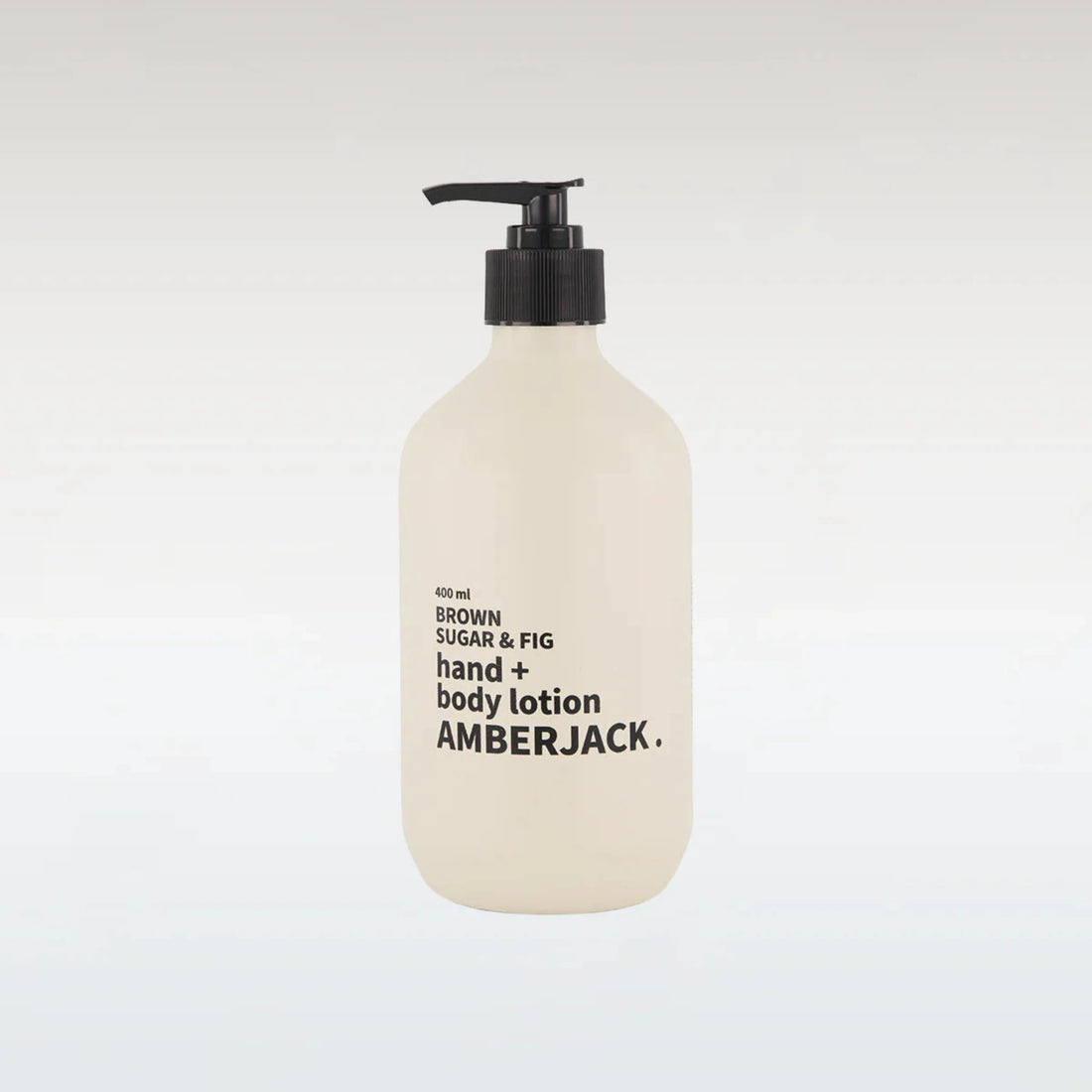 Hand and body lotion bottle with pump on a light gray background