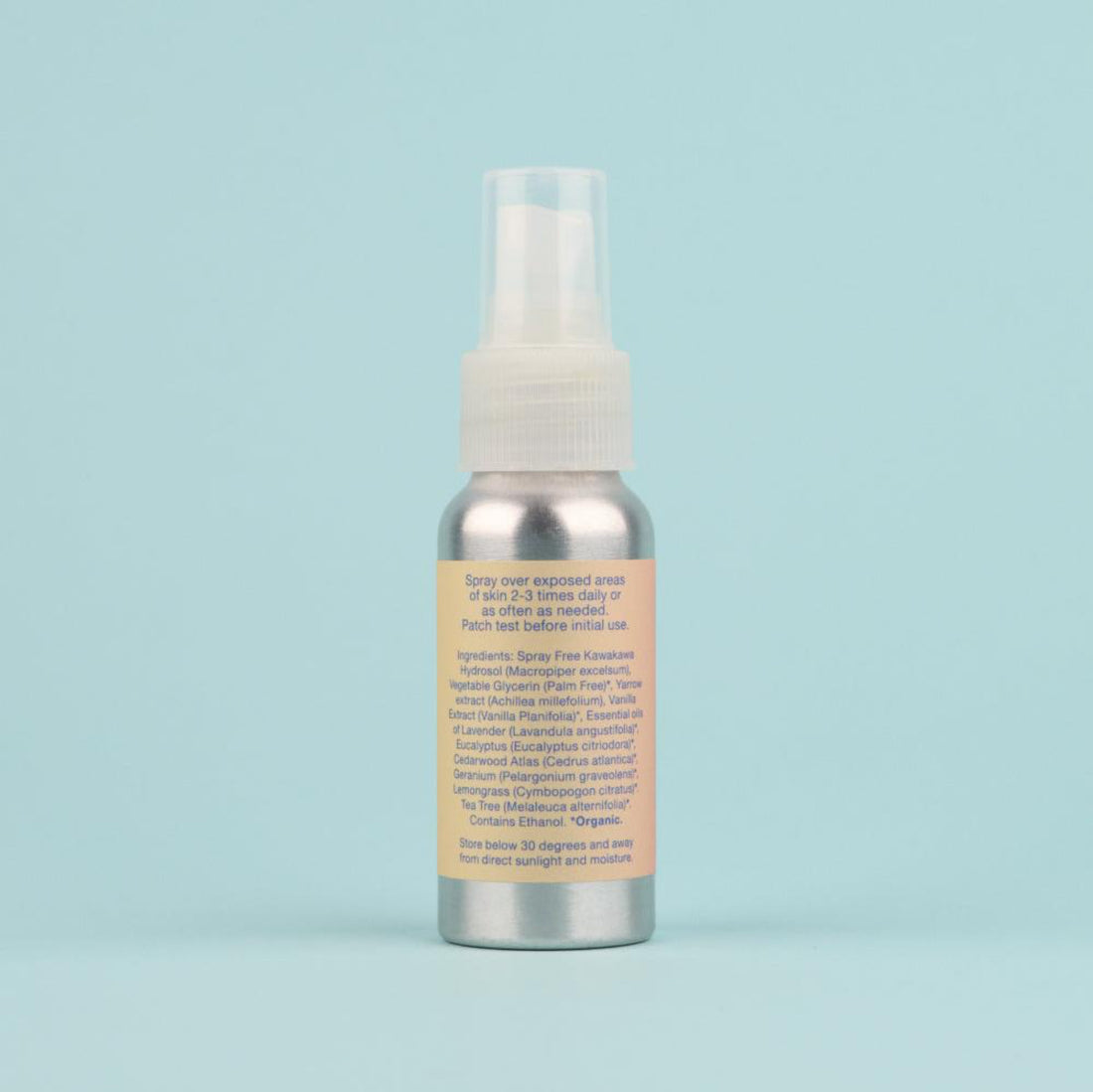 The back label of an aluminium bottle of Kawakawa Bug Spray on powder blue background. 