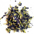 A small pile of dried butterfly pea flowers, showing deep purple-blue petals mixed with bright green stems, scattered on a plain white background.