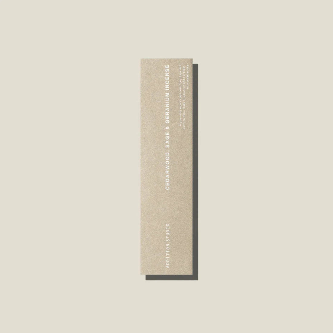 An oat coloured packet of cedarwood, age and geranium incense sticks. 