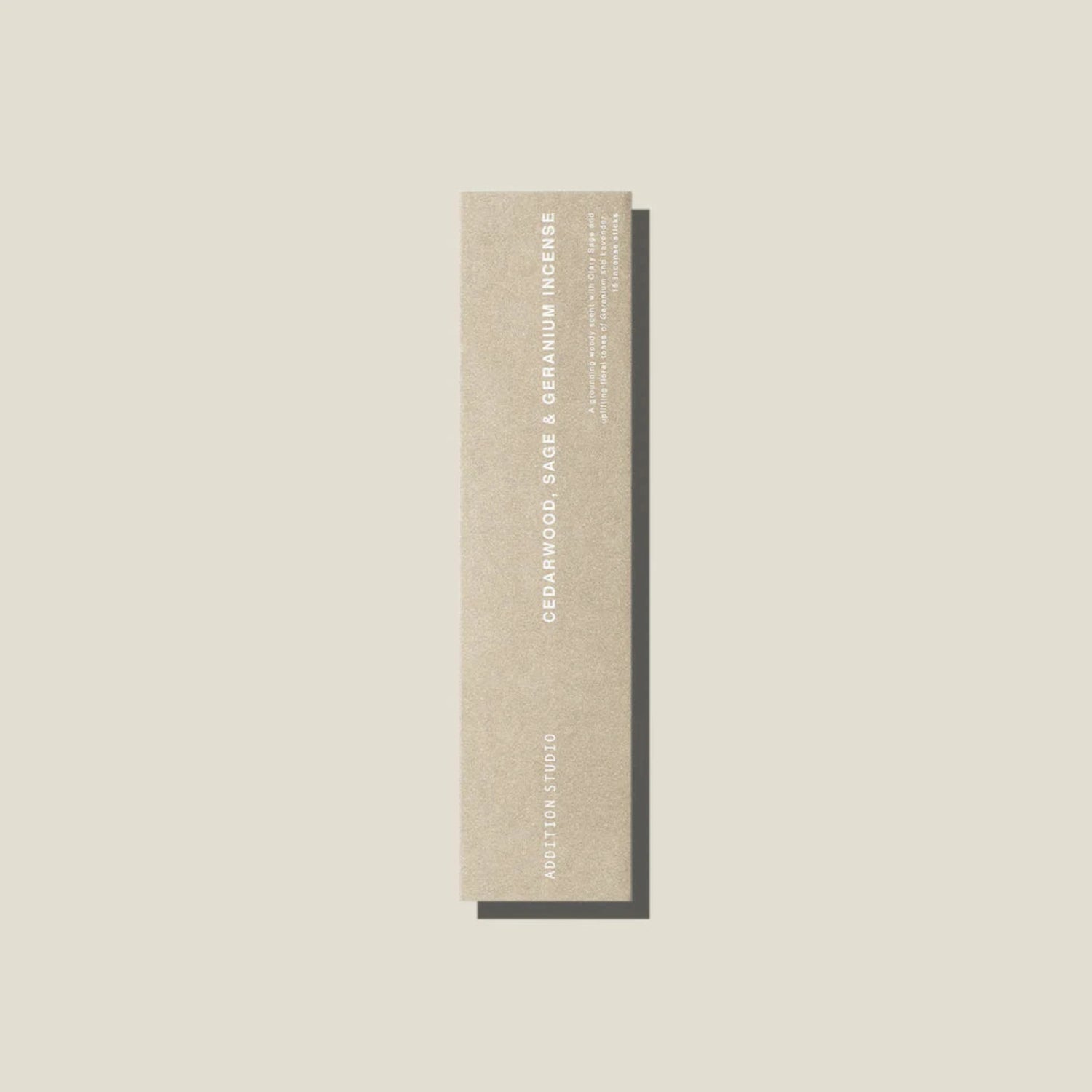 An oat coloured packet of cedarwood, age and geranium incense sticks. 