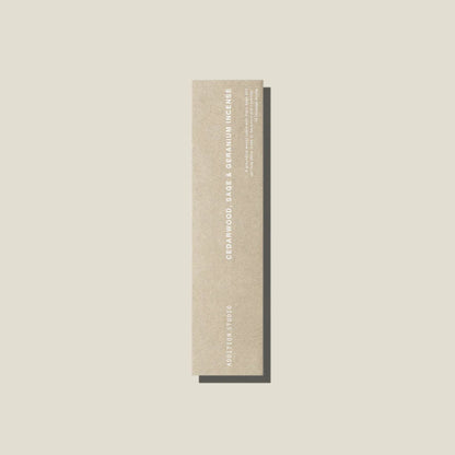 An oat coloured packet of cedarwood, age and geranium incense sticks. 