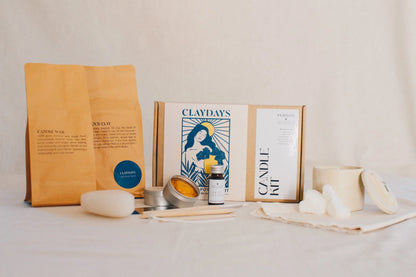 Candle-making kit with materials on a white surface