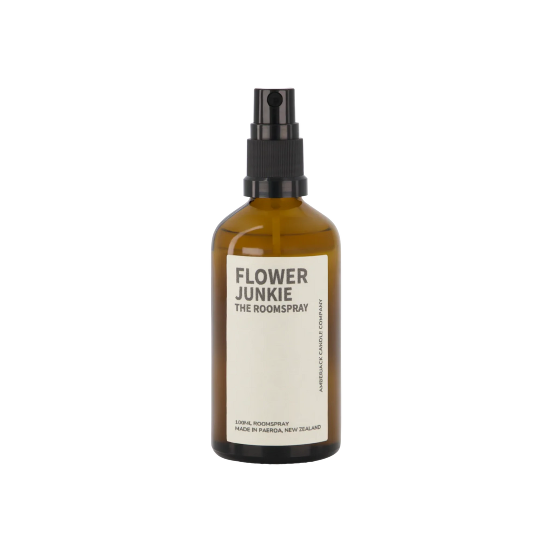 An amber glass bottle of Flower Junkie room spray by Amberjack. 