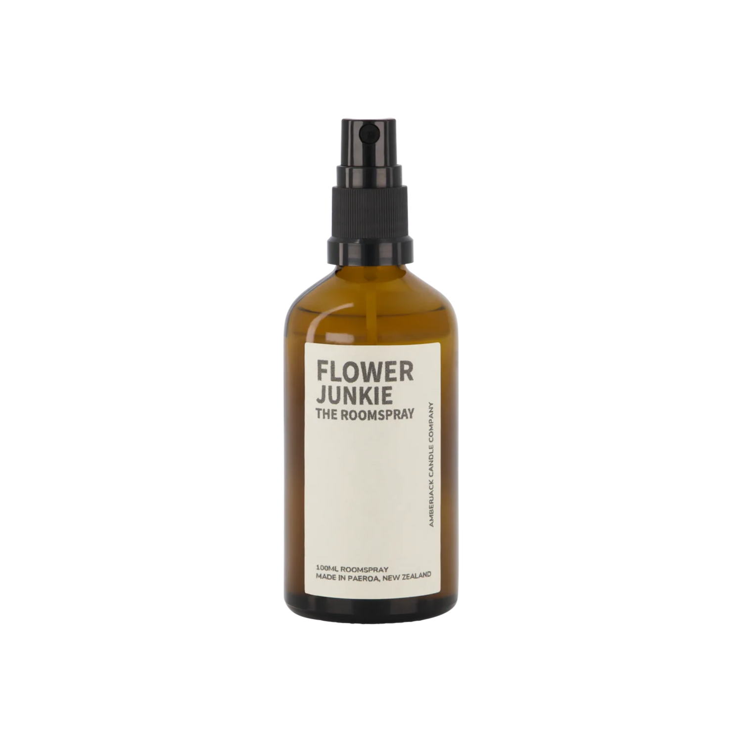 An amber glass bottle of Flower Junkie room spray by Amberjack. 