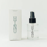 Clear spray bottle with black cap and &