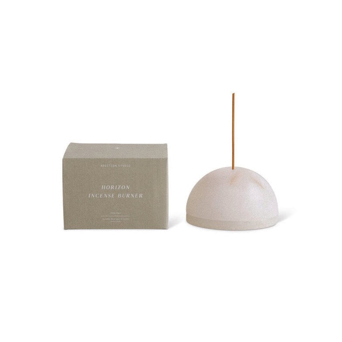 A white stone dome incense holder and its box, made by Addition Studio. 