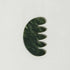 Green jade scalp stimulator on a white background