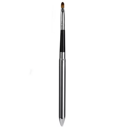 Makeup brush with black bristle tip on a white background
