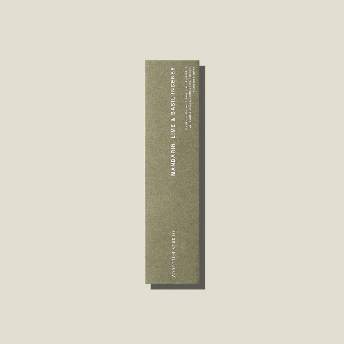 A sage green coloured packet of mandarin, lime and basil incense sticks. 