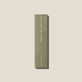 A sage green coloured packet of mandarin, lime and basil incense sticks. 