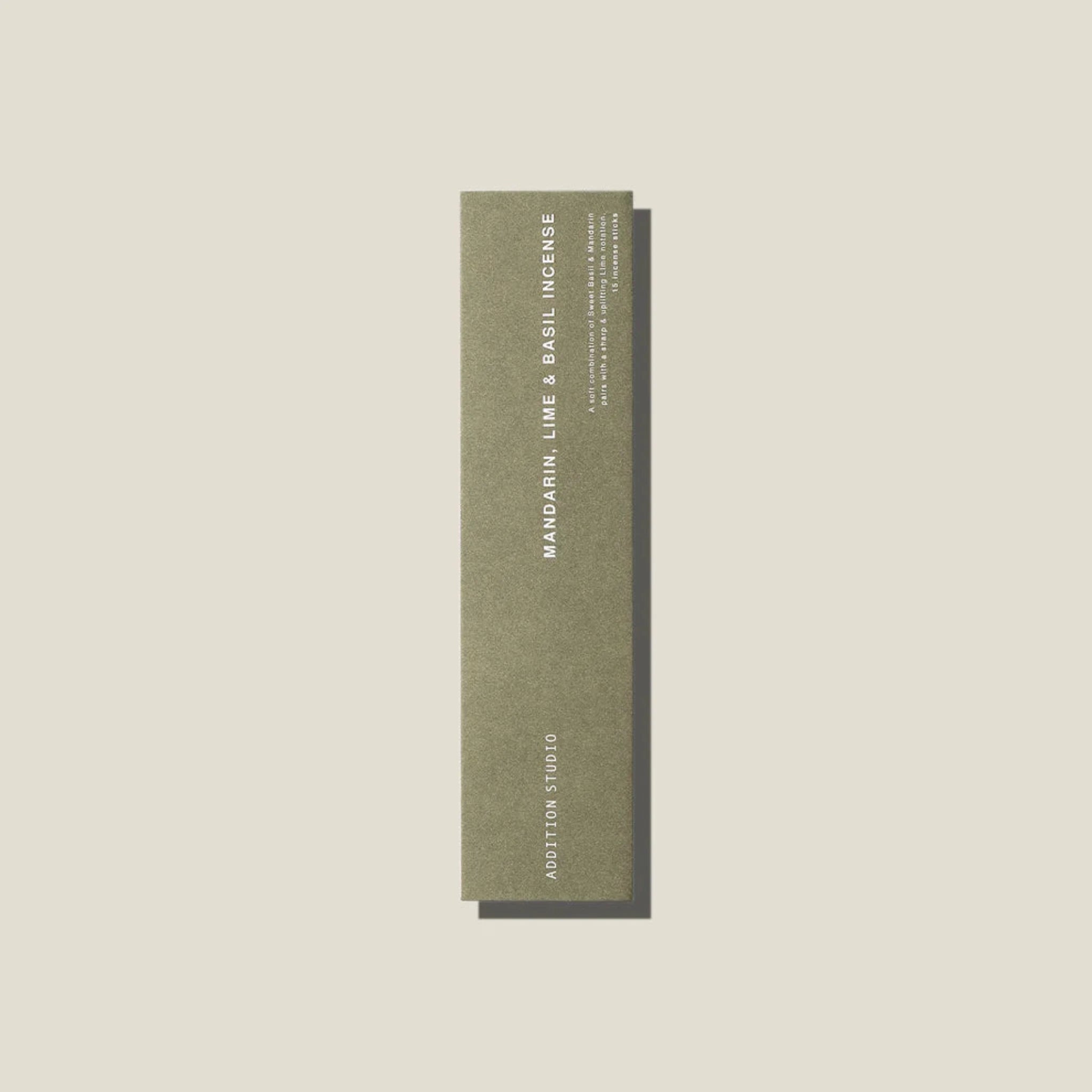 A sage green coloured packet of mandarin, lime and basil incense sticks. 