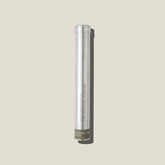 An aluminium tube containing mandarin, lime and basil incense sticks and holder. 