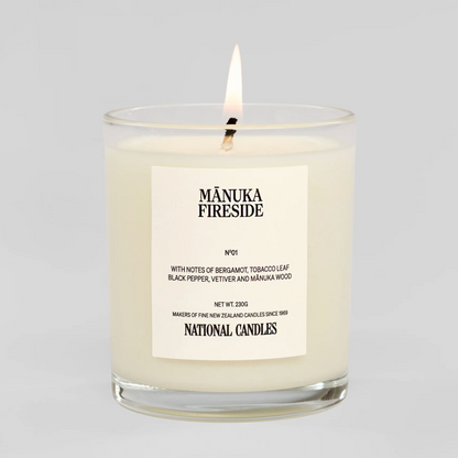 Manuka Fireside candle with a label on a white background