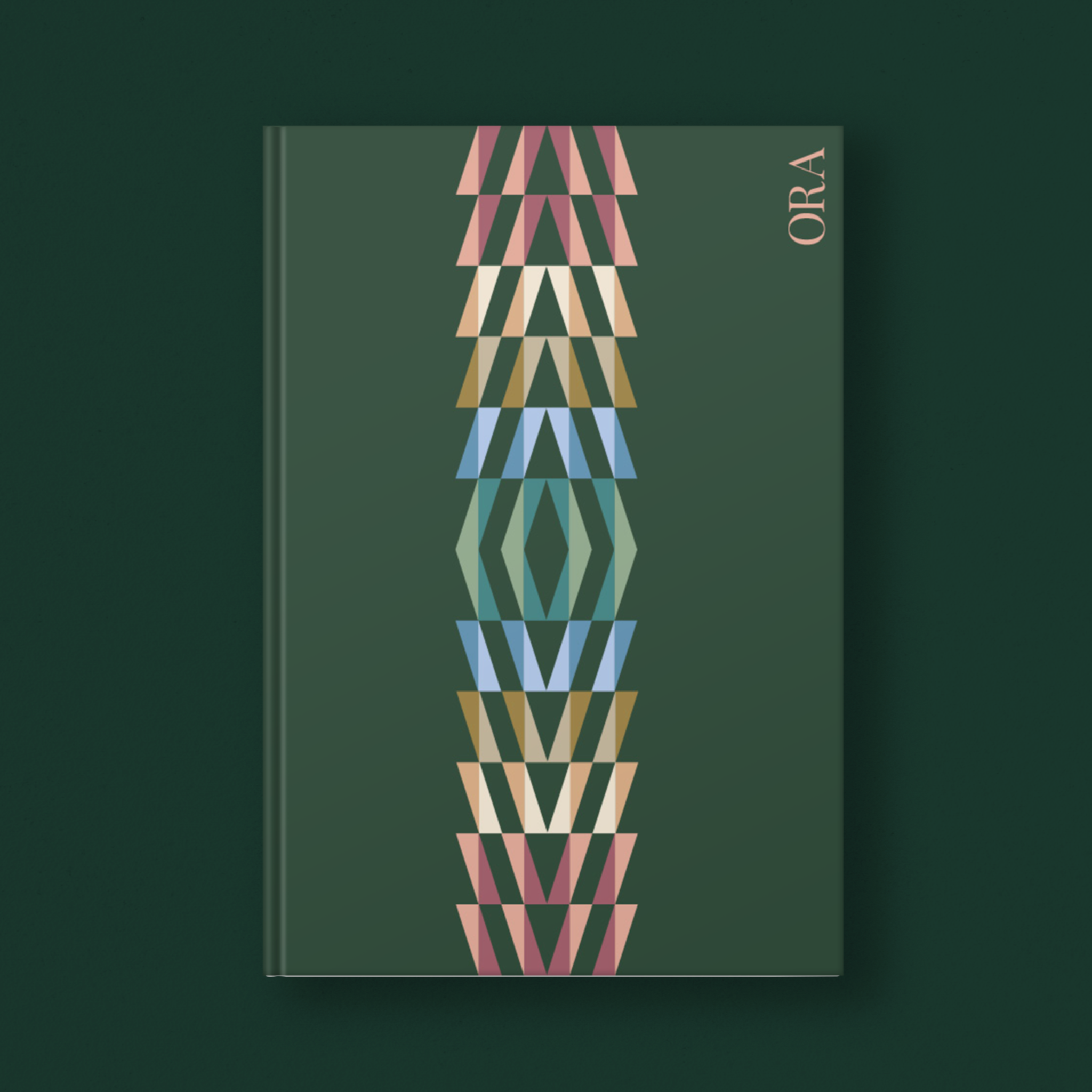 Book with geometric design on a dark green background