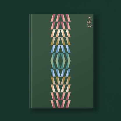 Book with geometric design on a dark green background