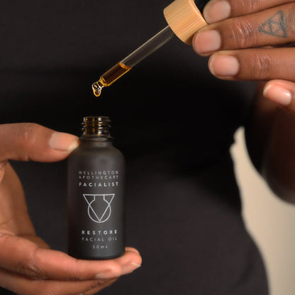 Person holding a bottle of &