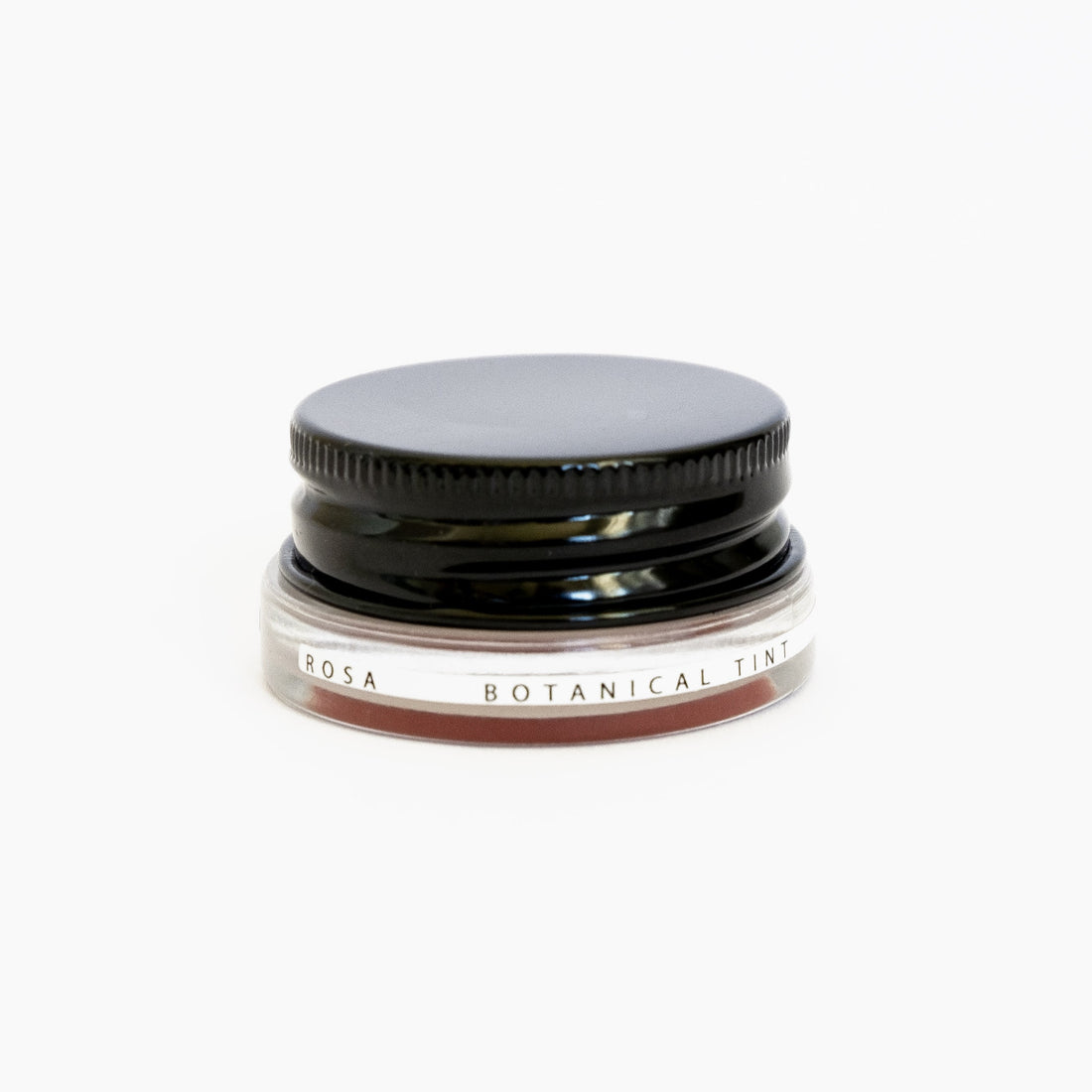 A small glass pottle of Rosa lip tint on white background. 