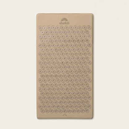 A rectangular beige massage pad with rows of circular textured bumps and the &