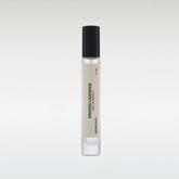 Small perfume bottle labeled &