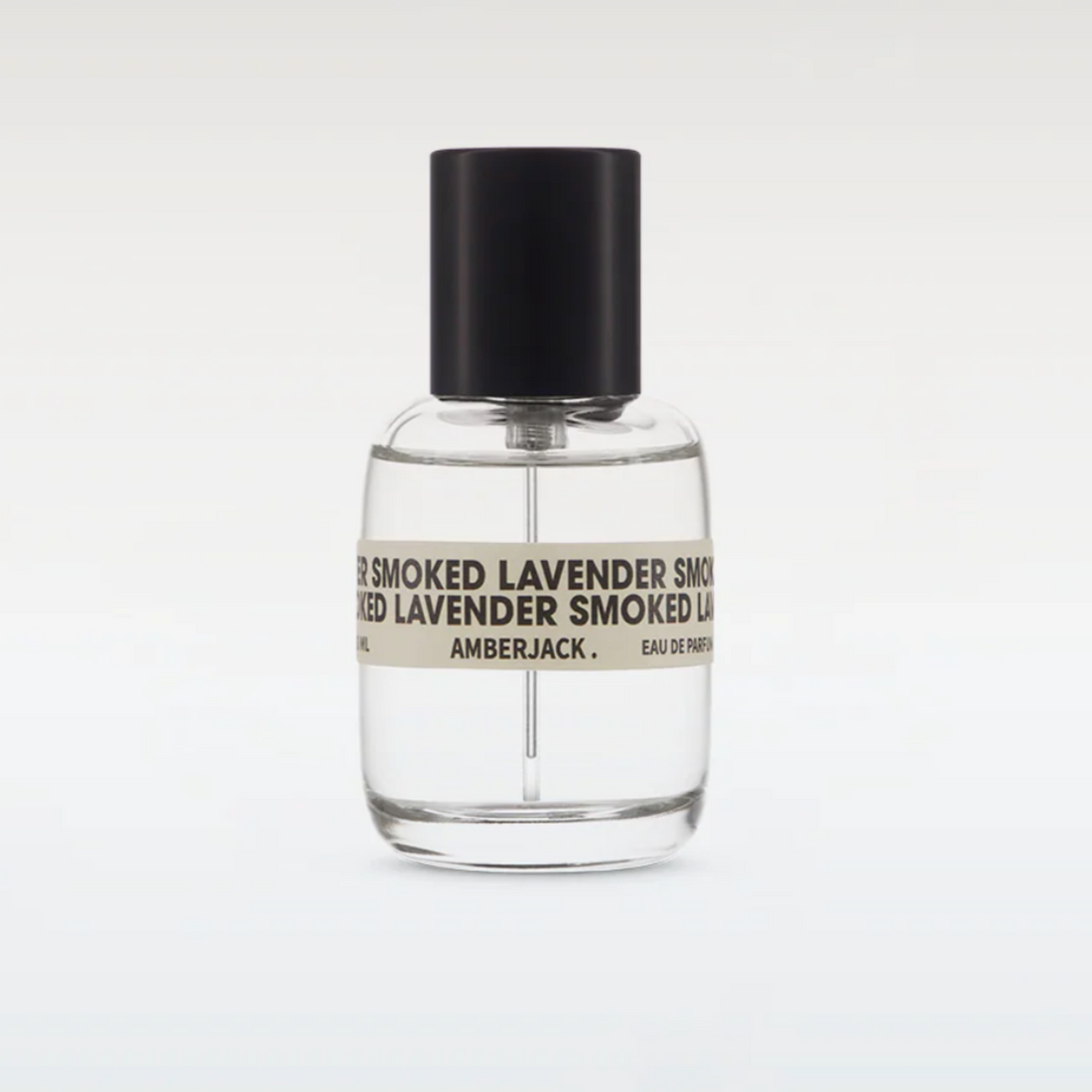 Clear perfume bottle with black cap and label on a white background
