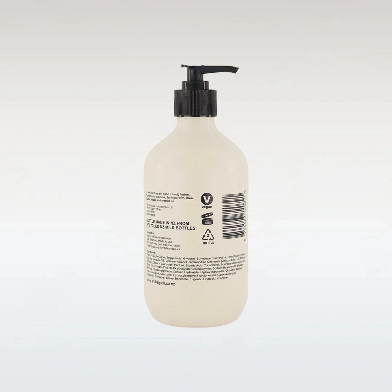 Beige bottle with black pump on a white background
