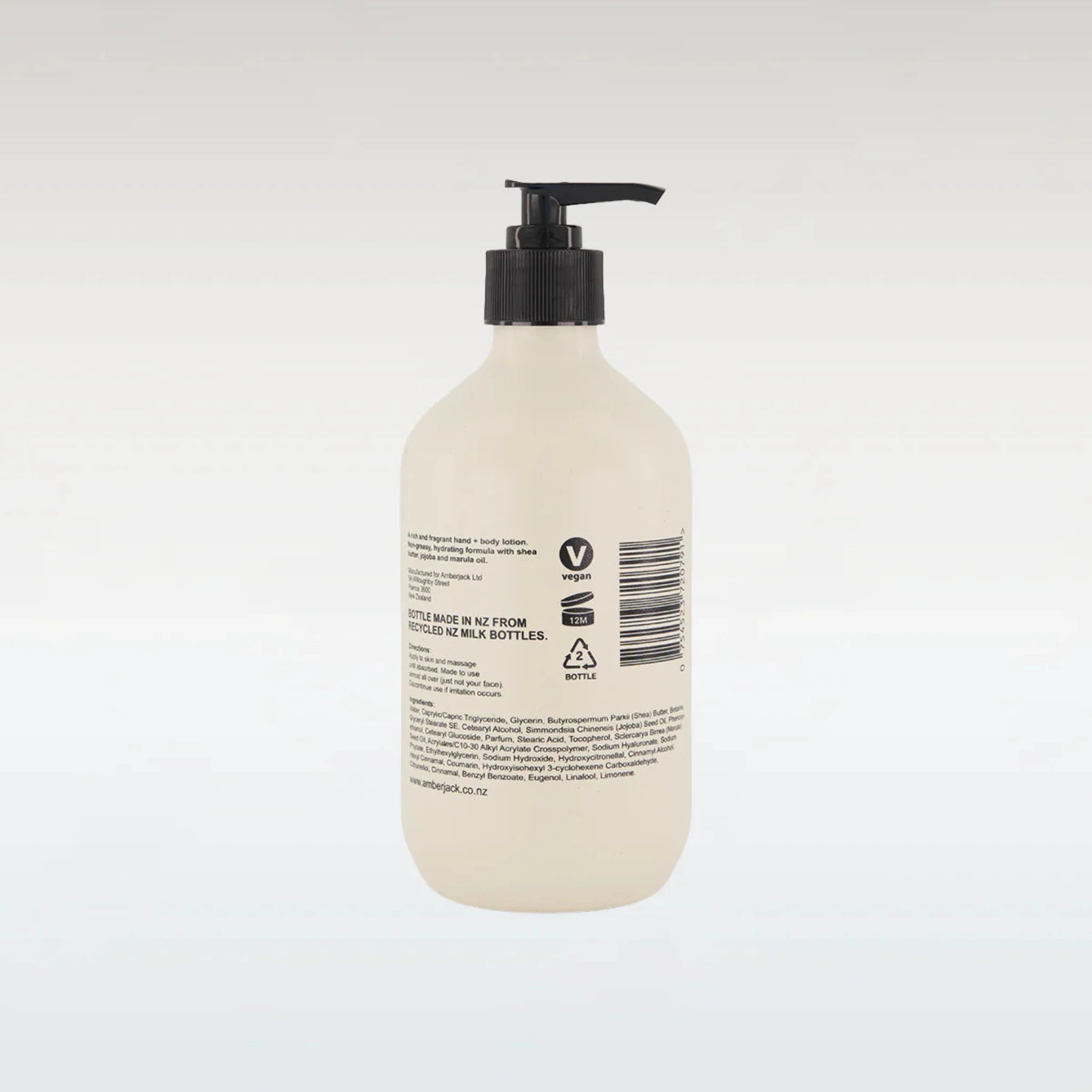 Beige bottle with black pump on a white background