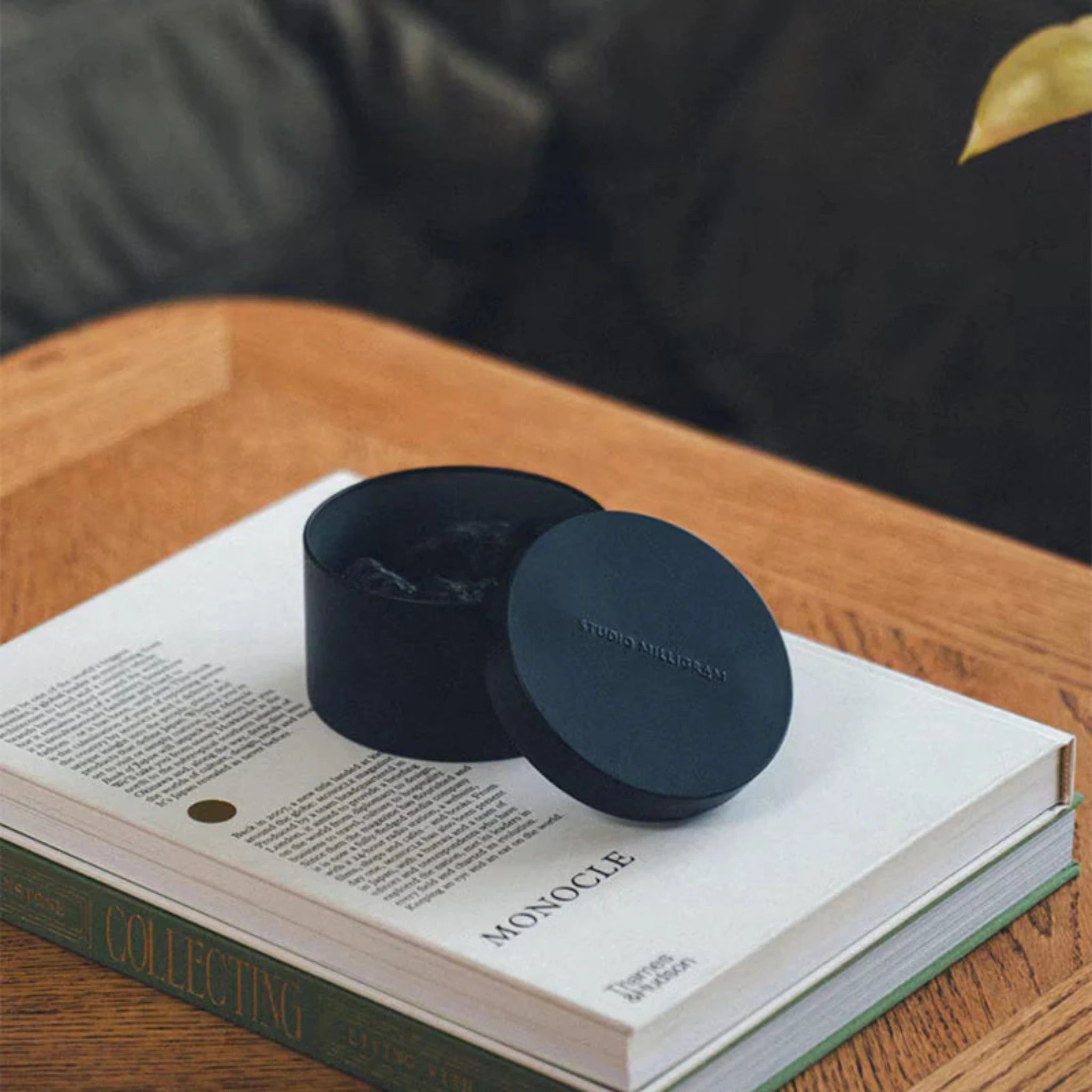 Scented volcanic rock set on an open book titled &