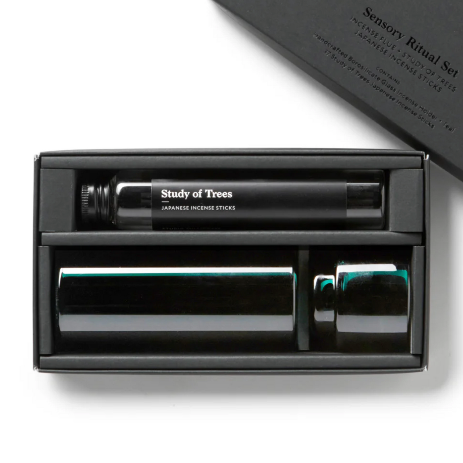 Incense sticks set in a black box with &