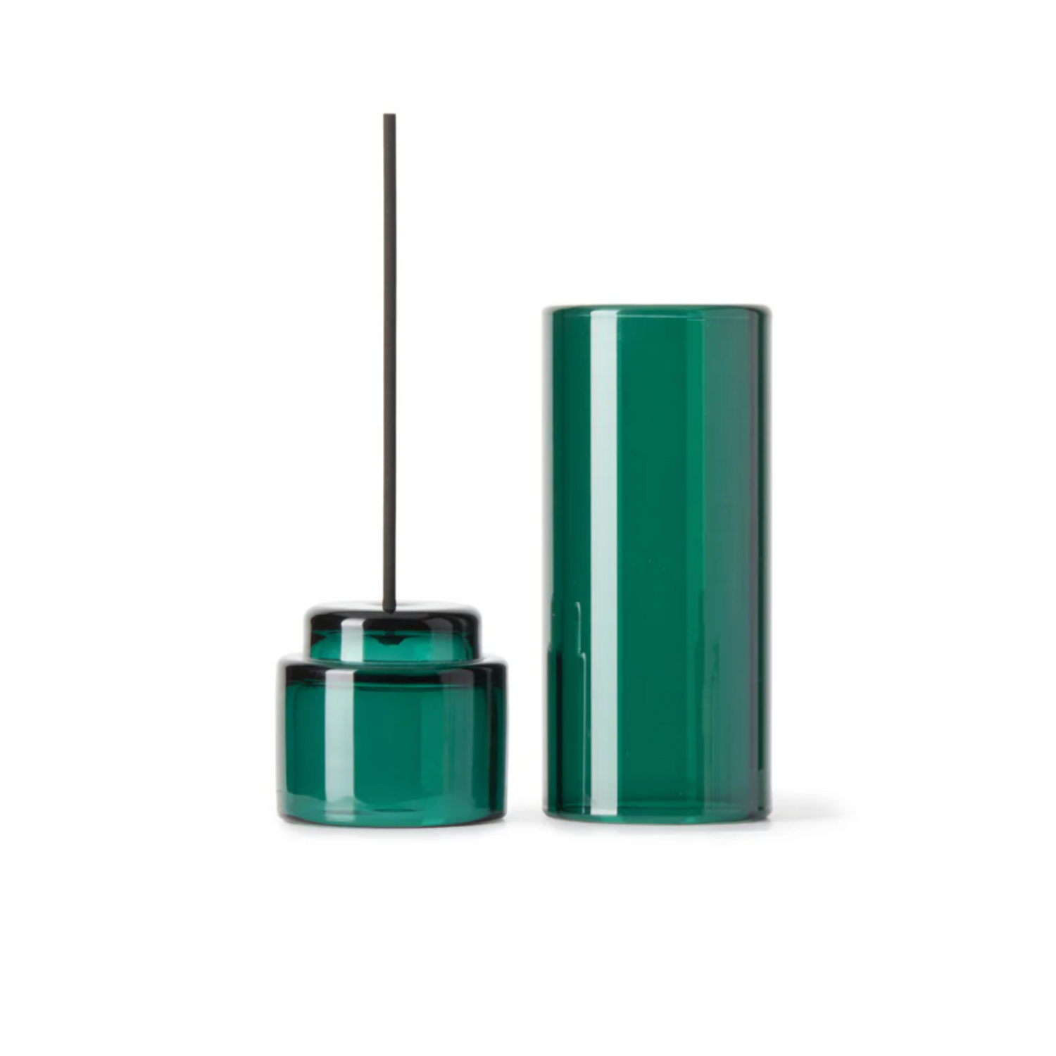 Green glass incense holder with a single stick on a white background
