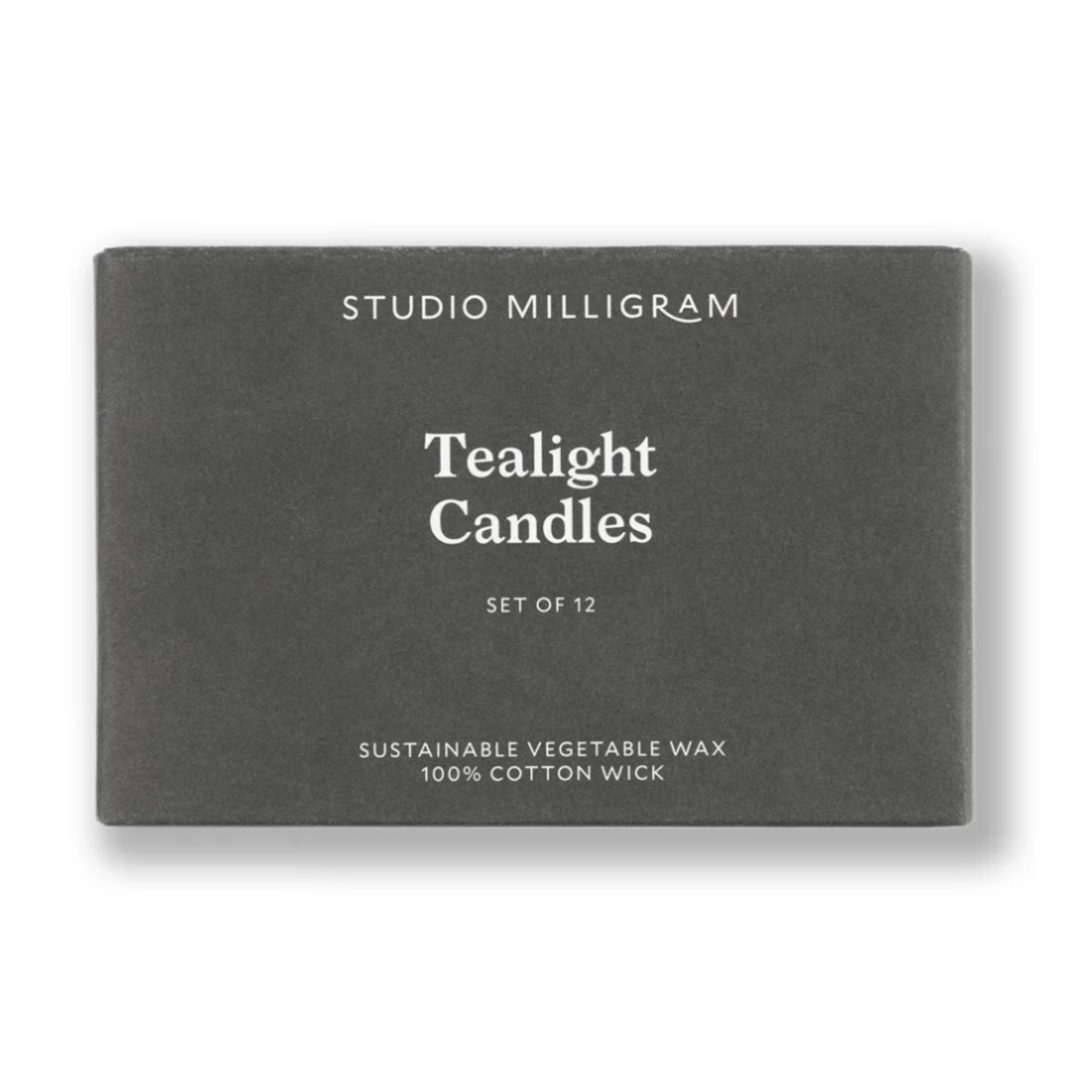 Box of Studio Milligram tealight candles on a white background