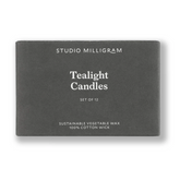 Box of Studio Milligram tealight candles on a white background
