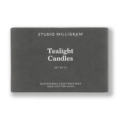 Box of Studio Milligram tealight candles on a white background