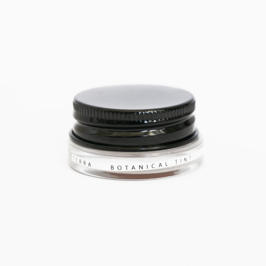A small glass pottle of Terra lip tint on white background. 