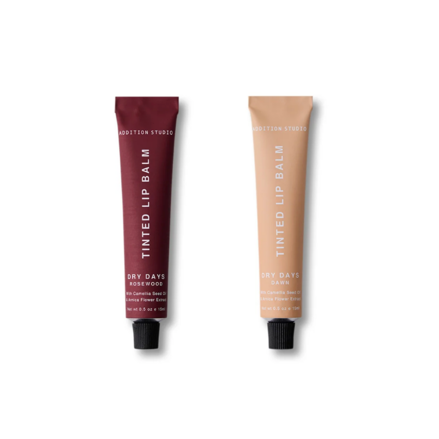 Two tubes of tinted lip balm on a white background