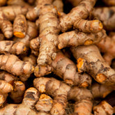 Close-up of a pile of turmeric roots